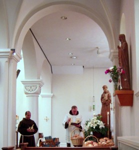 Fr. John Bok, OFM, blesses the St. Anthony Bread at the Shrine