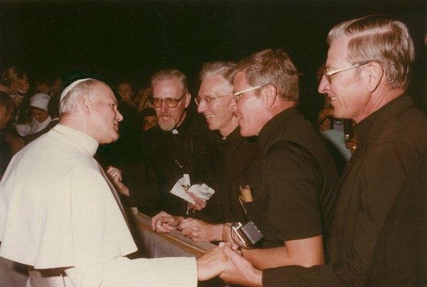 Pope John Paul II meets the four Schneider brothers, all Franciscan priests: Aquinas, Bernardin, Ric, and Chris.