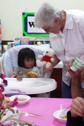 Sr. Anita Jennissen offers a stuffed animal as a comfort.