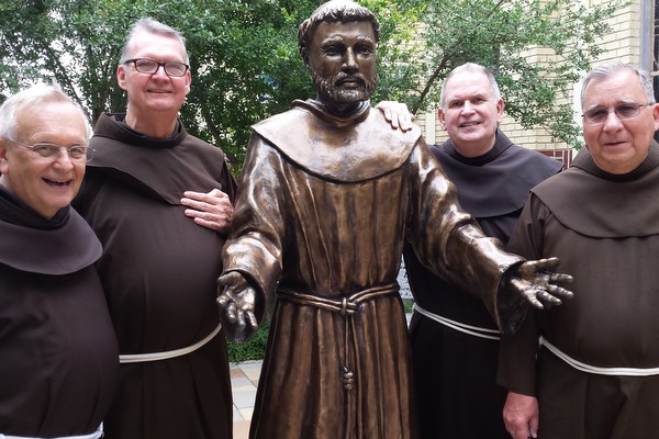 ABVM Friars with a welcoming statue of Francis at Sacred Heart Church in McAllen, Texas