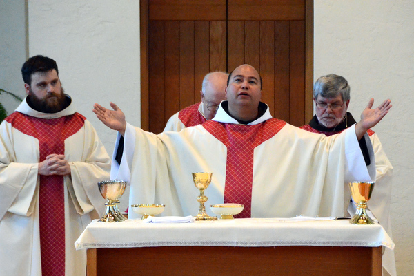 Newly Ordained Fr. Cliff Hennings (left) and Fr. Roger Lopez with Bishop Joe Binzer and Provincial Minister Jeff Scheeler