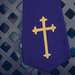 cross on purple fabric
