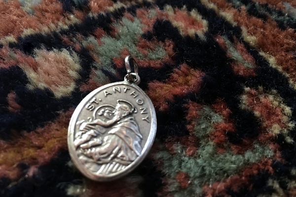 St. Anthony medal on carpet