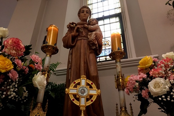 St Anthony statue with candles and relic