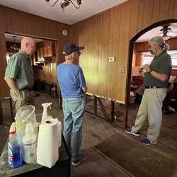 3 people talking inside home