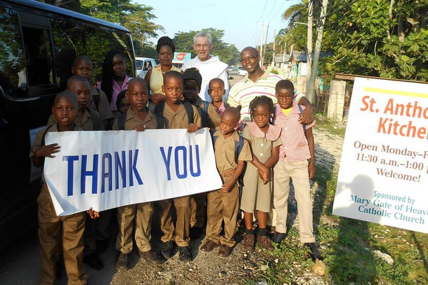 Fr. Jim Bok with students before drive to school and after a good breakfast at St. Anthony's Kitchen