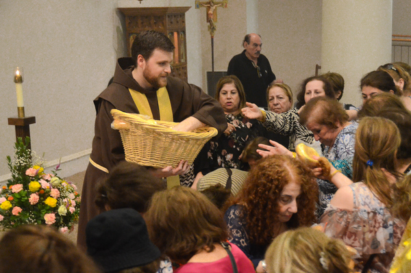 friar handing out bread