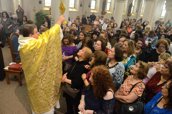 friar and crowd in chapel