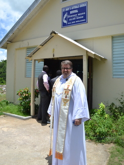 friar in front of church