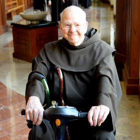 Fr. Cyprian, age 93, tooling around on his scooter.