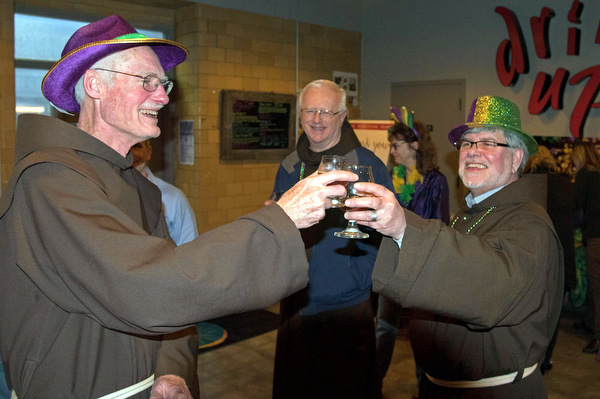 Friars Frank Jasper, Al Hirt, and Jeff Scheeler toast the release of St. Anthony's Quad Beer