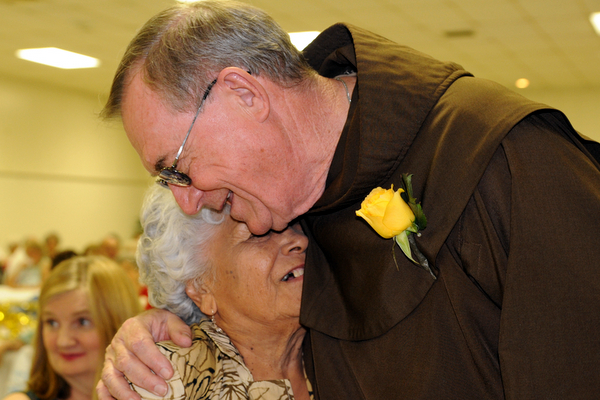 Fr. John Bok with a parishioner