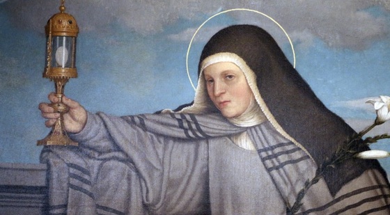 st Clare holding lantern