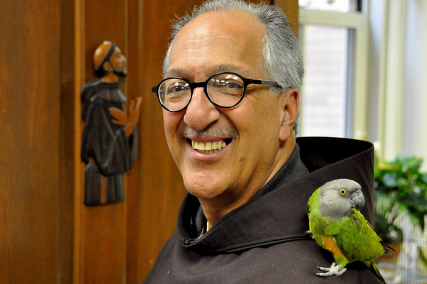 parrot on shoulder of friar