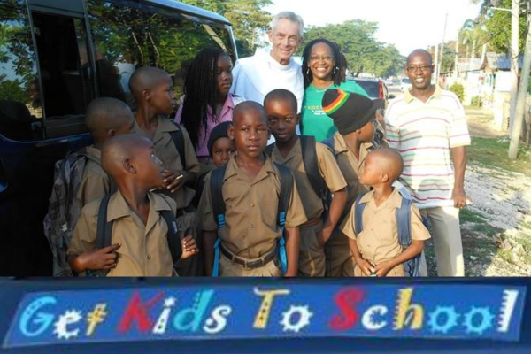 Fr. Jim Bok, OFM, Joan Cooney (Ms. Joans) with students from the 'Get Kids To School' program as they board 'Josey' the van that will take them to school.