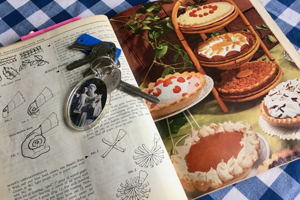 cookbook with keys on table