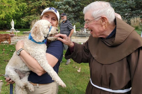 friar and dog