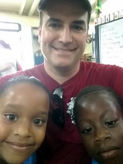 Br. Matt with children in Jamaica in 2018