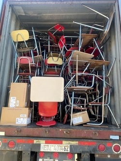desks and chairs in truck