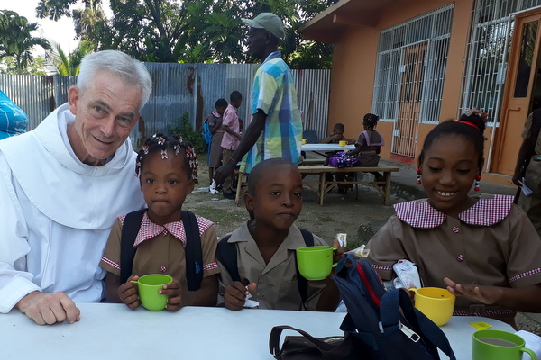 friar and students at table