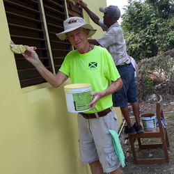 man painting house