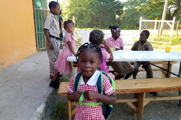 children eating at picnic tables