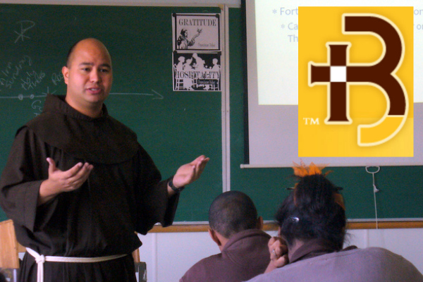 Fr. Roger Lopez, OFM, in the classroom at Roger Bacon, H. S.