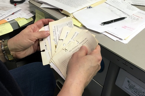 hands holding index cards