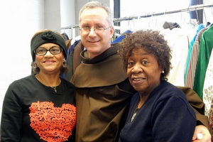 Fr. Alex with helpers at the food pantry clothing outlet