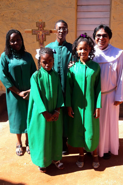 Fr. Saleem Amir with servers at Orange Hill, Jamaica