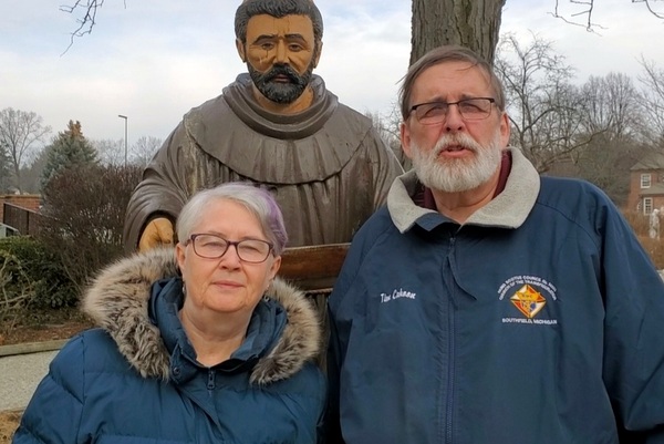 Man& Woman with St. Francis statue