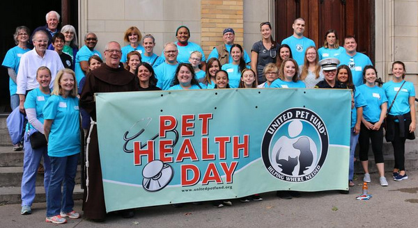 Br. Tim Sucher, OFM, with the doctors and volunteers who made Pet Health Day a reality.