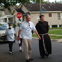 friar and people on street