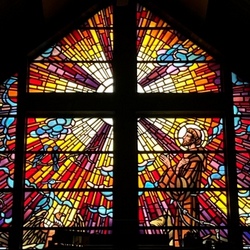 colorful window with cross and francis