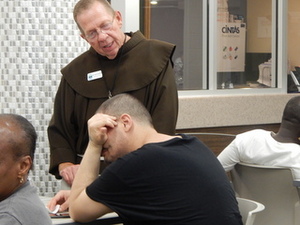 Br. David counsels a guest.