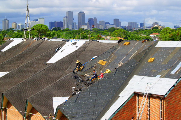 men repairing roof