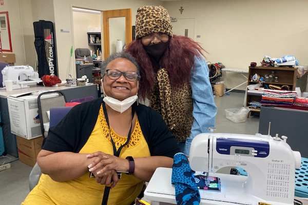 2 women sewing