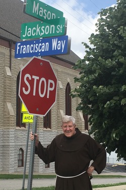 Fr. Ric with street sign