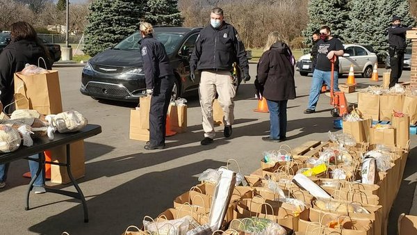 people and bags of groceries