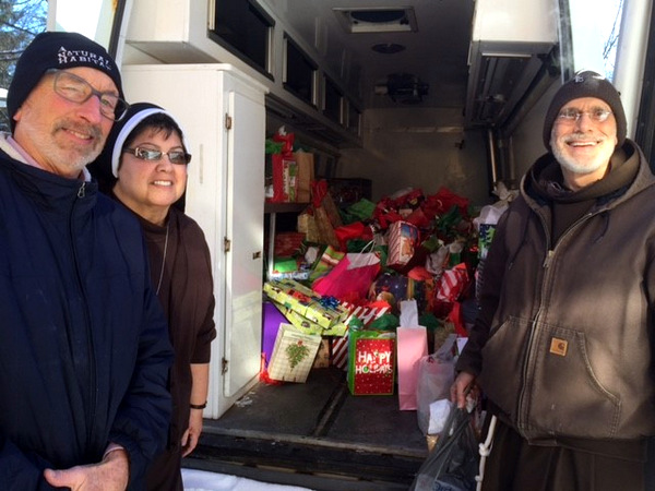 Volunteer Tom Grassa, Sr. Francesca, and Br. Al Mascia filled the Care'avan with hundreds of useful items to be turned into CarePax and distributed on the streets of Detroit