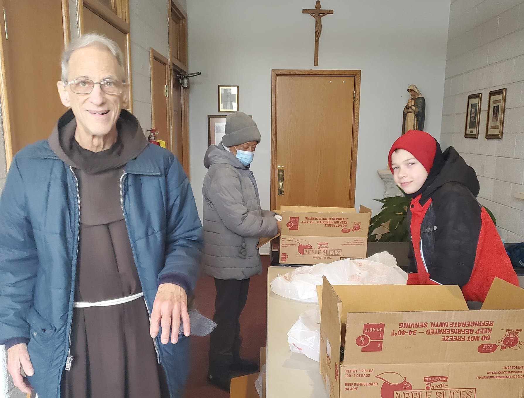 Friar Louis Zant helps feed the hungry