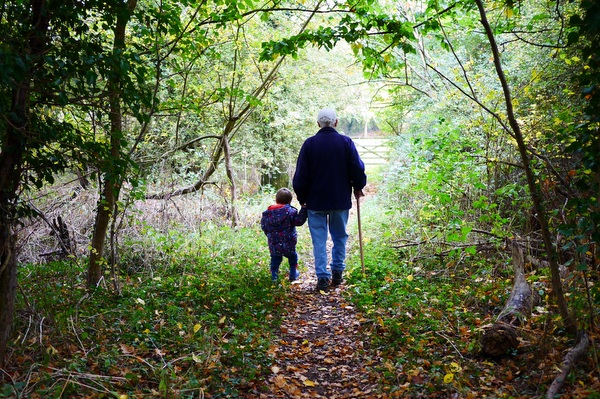 grandpa and grandson in woods