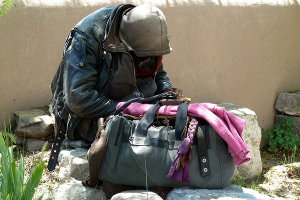 homeless person with bag