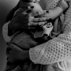 mother holding baby