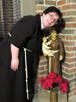 woman with St. Anthony statue